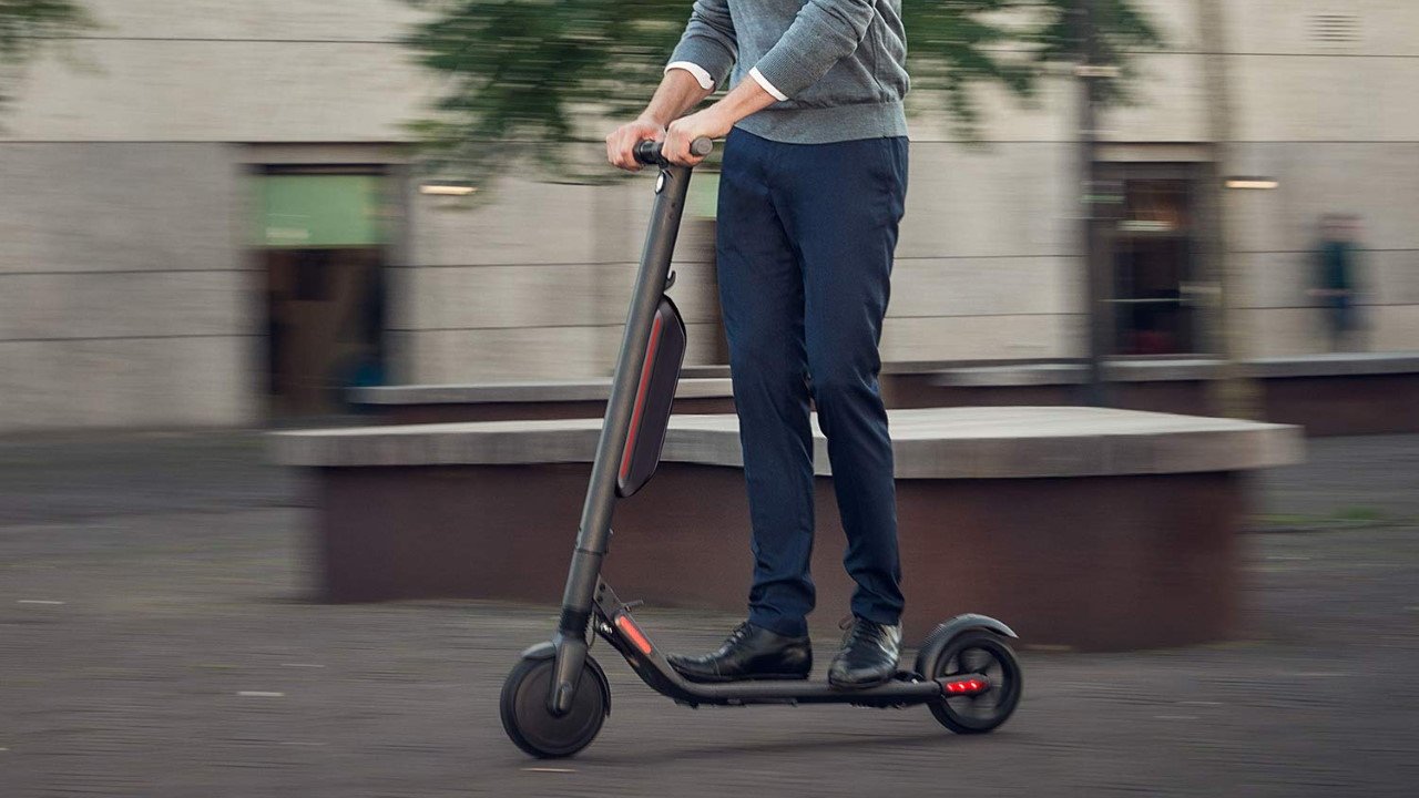 Man riding a Ninebot Electric Scooter